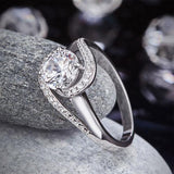 Twist Bezel 1.25 Carat Round Cut Sapphire Ring